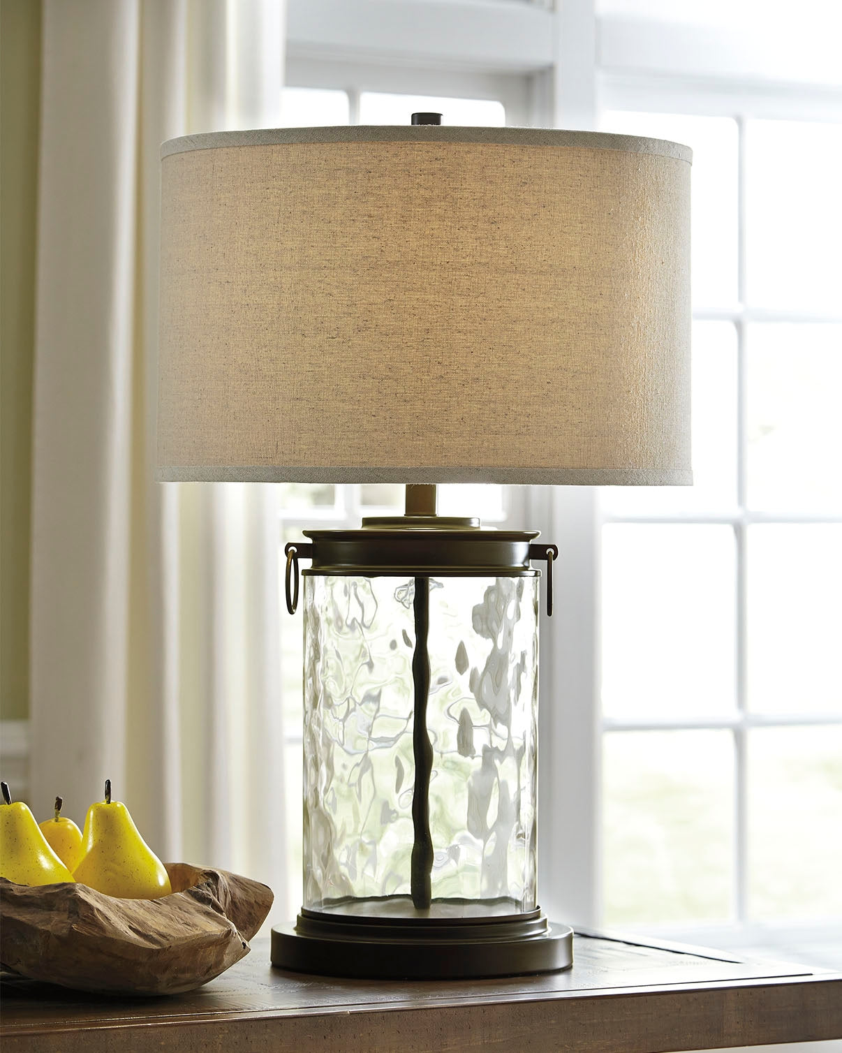 Furniture City Slidell - Ashley Furniture - Tailynn Lighting - Glass Table Lamp (1/CN) / Clear/Bronze Finish - L430324