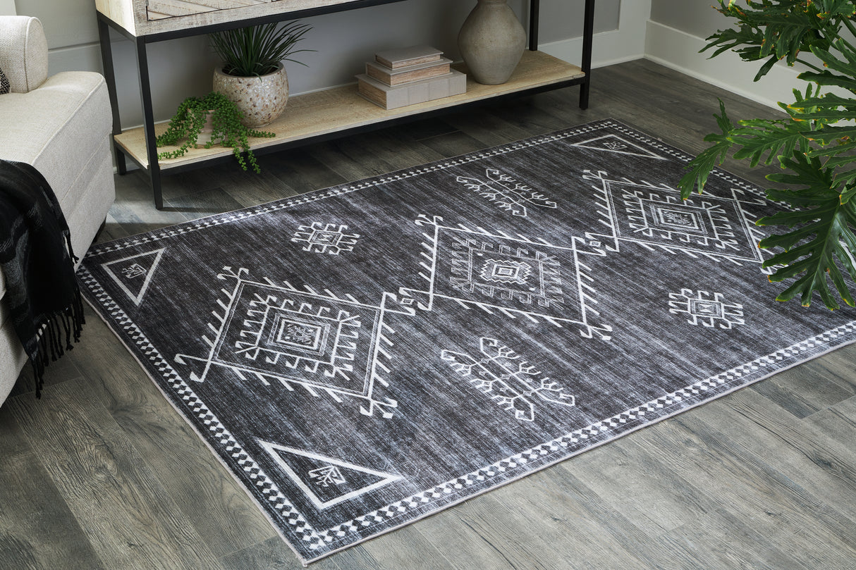 Furniture City Slidell - Ashley Furniture - Arloman Rug - 5' x 7' Washable Rug / Black/Cream/Gray - R405932