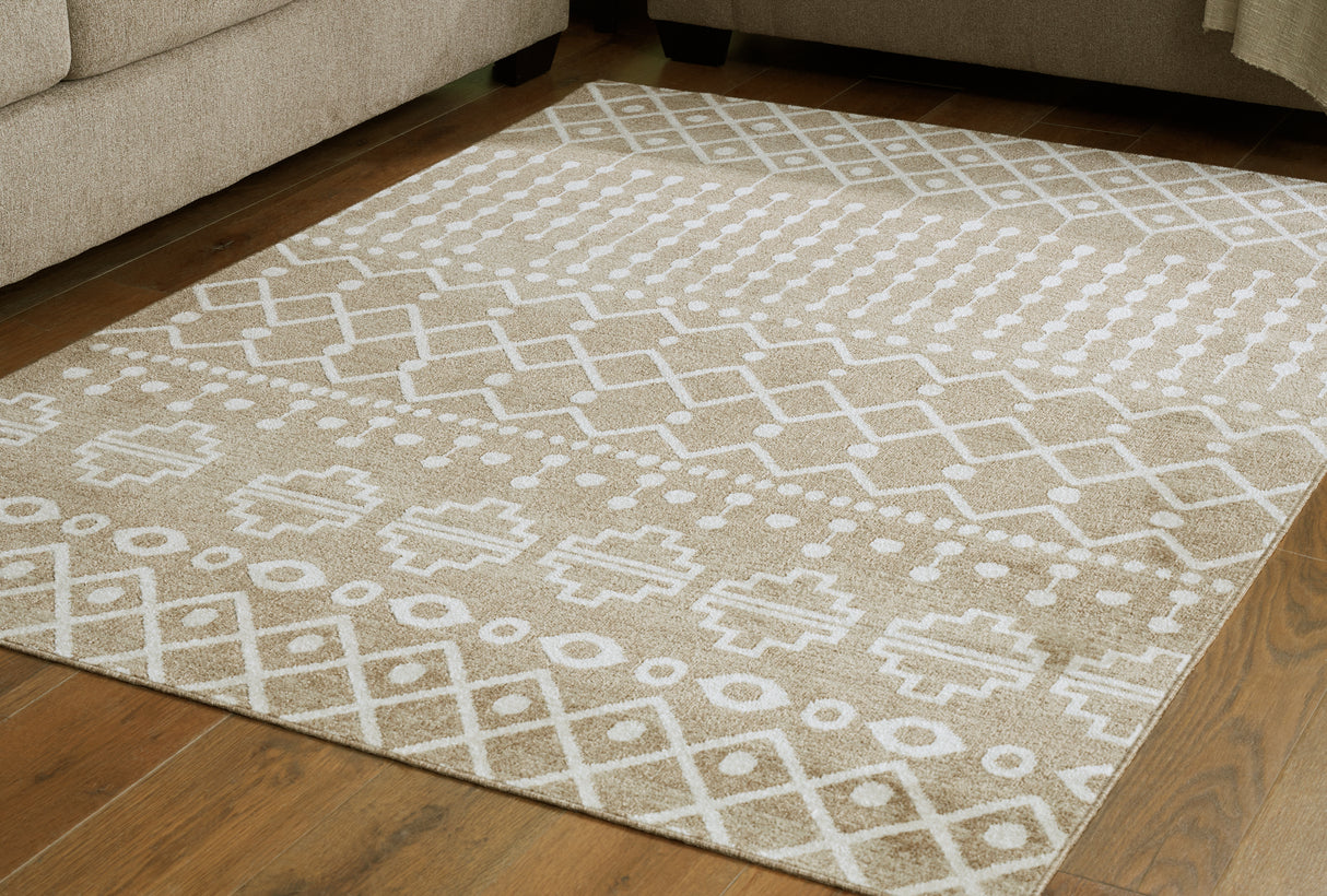Furniture City Slidell - Ashley Furniture - Bunchly Rug - 4'11" x 7'2" Washable Rug / Tan/Brown/Cream - R406222