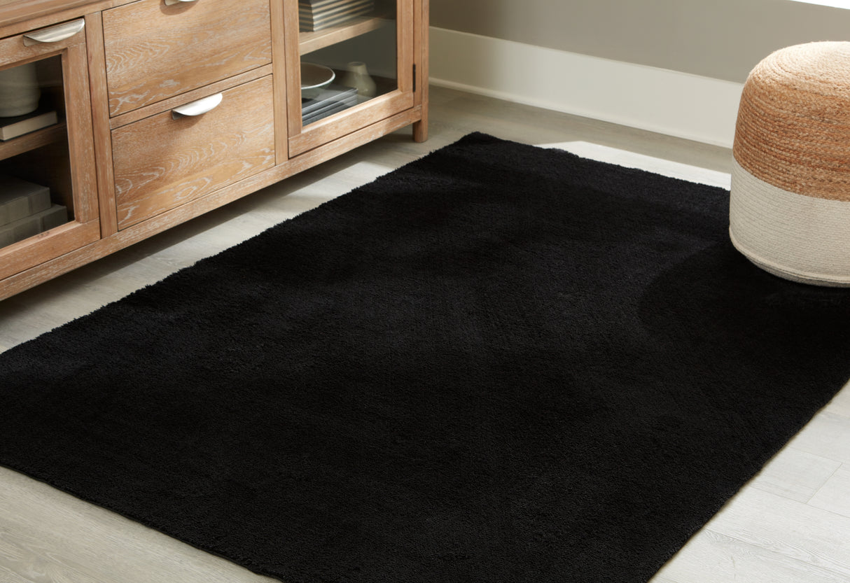 Furniture City Slidell - Ashley Furniture - Anaben Rug - 5' x 7' Washable Rug / Black - R406312