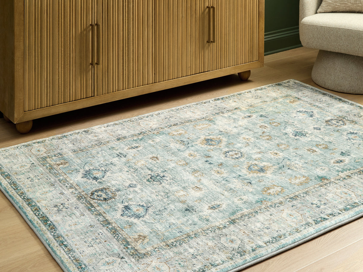 Furniture City Slidell - Ashley Furniture - Ladstoney Rug - 5' x 7' Area Rug / Teal/Beige/Ochre - R407502