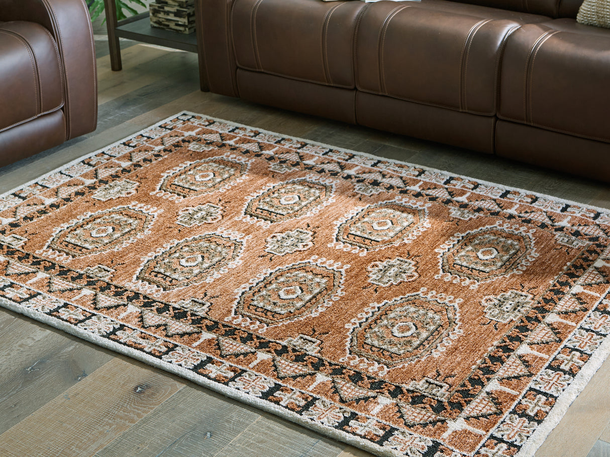 Furniture City Slidell - Ashley Furniture - Qaabiz Rug - 5' x 7' Area Rug / Sienna/Ivory/Black - R407522