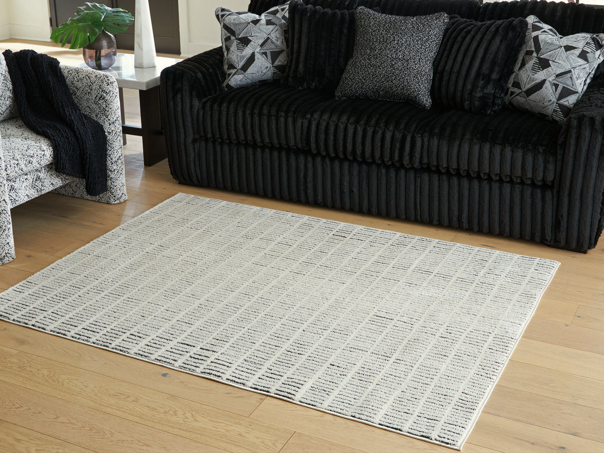 Furniture City Slidell - Ashley Furniture - Turinwith Rug - 5'3" x 7' Area Rug / Ivory/Black - R407552