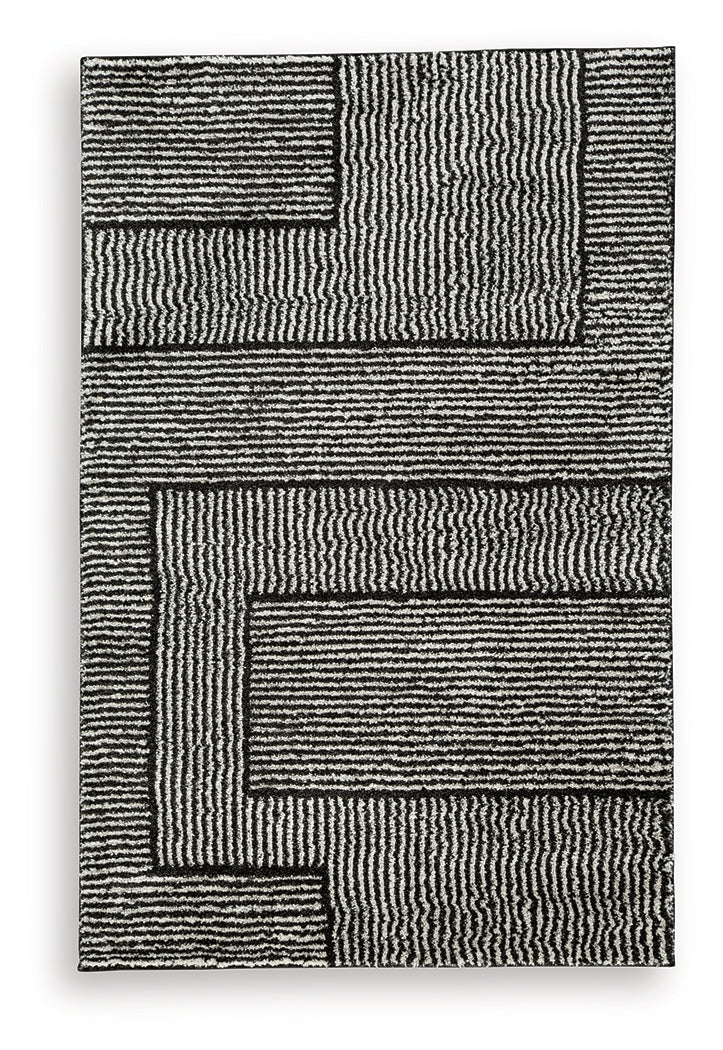 Furniture City Slidell - Ashley Furniture - Kurtmen Rug - 5' x 7' Area Rug / Black/Ivory - R407592