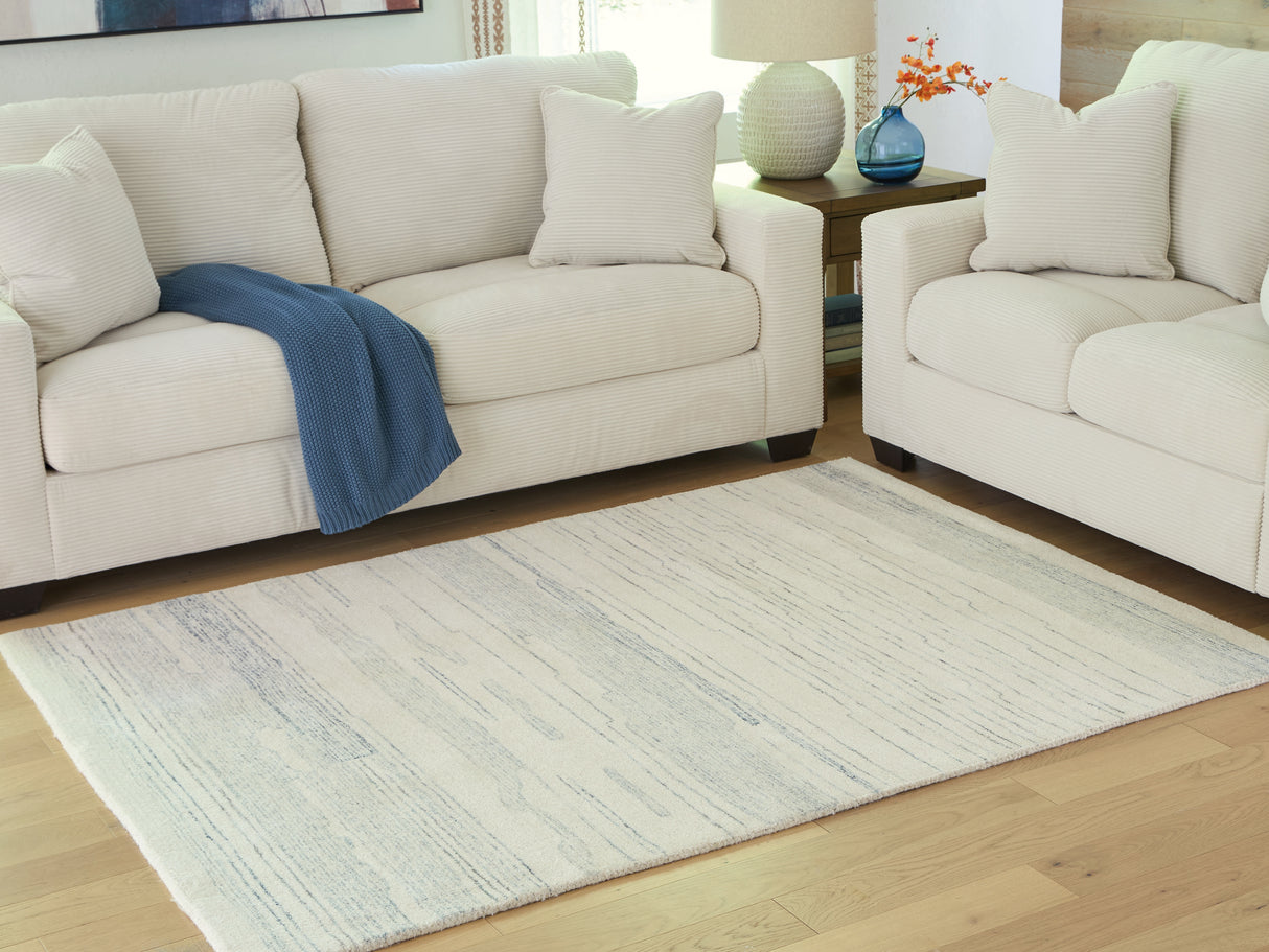 Furniture City Slidell - Ashley Furniture - Genemost Rug - 7'8" x 10' Area Rug / Ivory/Blue - R407841