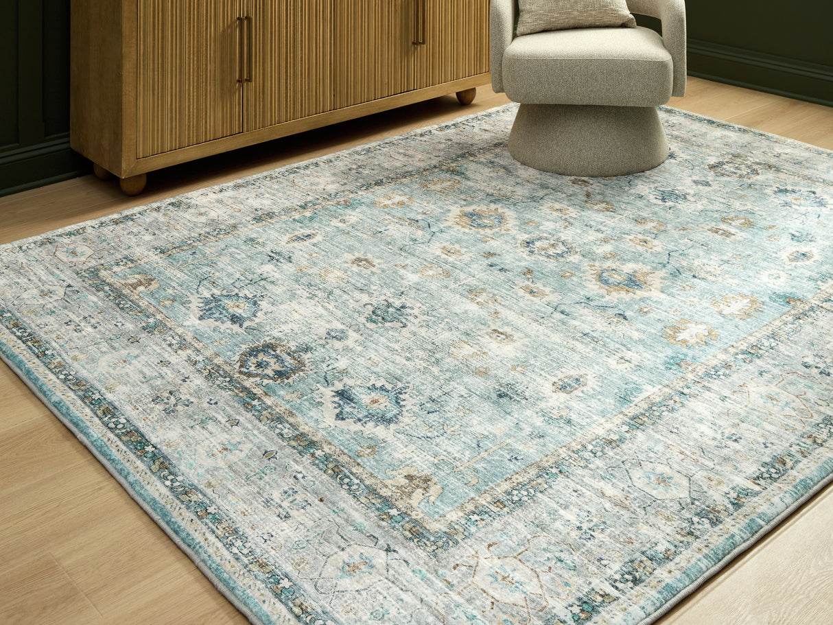 Furniture City Slidell - Ashley Furniture - Ladstoney Rug - 5' x 7' Area Rug / Teal/Beige/Ochre - R407502
