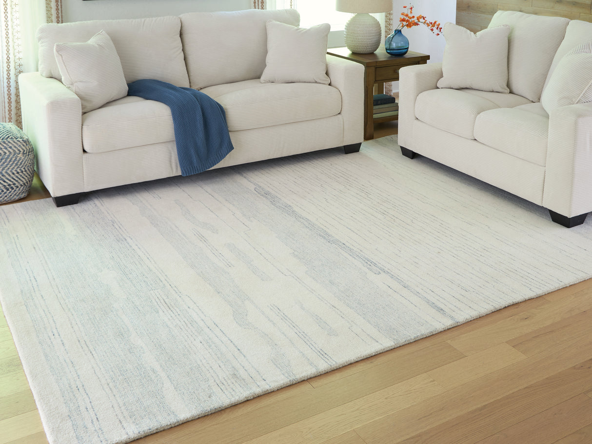 Furniture City Slidell - Ashley Furniture - Genemost Rug - 7'8" x 10' Area Rug / Ivory/Blue - R407841
